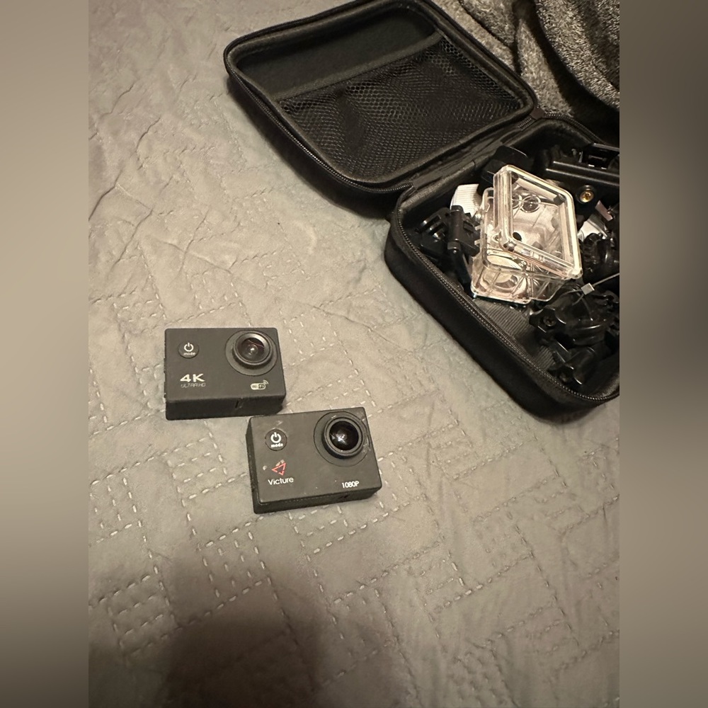 Two small outdoor action cameras.